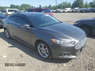 2016 Ford Fusion SE Hybrid z VIN 3FA6P0LU3GR173886, wystawiony jako Copart lot #60066015 z przebiegiem 140 328 mil mil oraz Szkoda całkowita • Salvage title. Historia ofert i sprzedaży dostępna na DreamBid. Obrazek 4.
