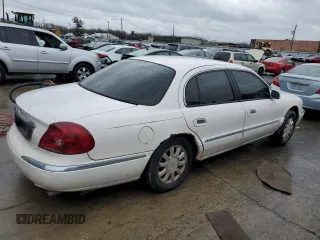 1999 Lincoln Continental with VIN 1LNHM97V3XY667567, listed as a Copart auction lot 84194854 with 137,163 mi miles and Salvage Title. Bid and sale history available at carsss.com. Image 3.