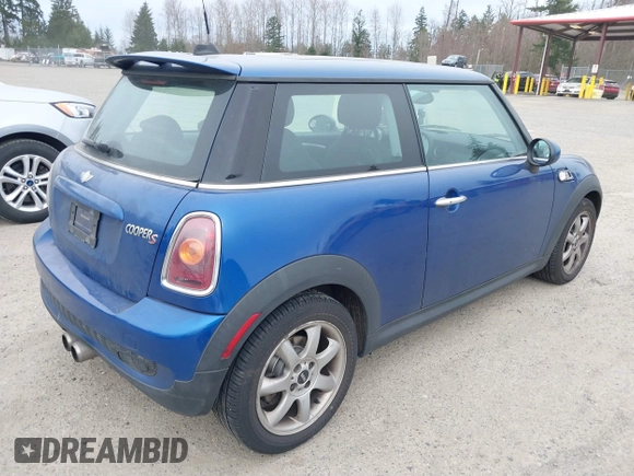 2007 MINI Hardtop S with VIN WMWMF73527TL91061, listed as a IAAI auction lot 41842104 with 65,259 mi miles and . Bid and sale history available at DreamBid. Image 4.