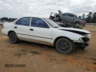 1996 Geo Prizm z VIN 1Y1SK5267TZ054974, wystawiony jako Copart lot #85669264 z przebiegiem Nie podano mil oraz Szkody całkowita. Historia ofert i sprzedaży dostępna na DreamBid. Obrazek 4.
