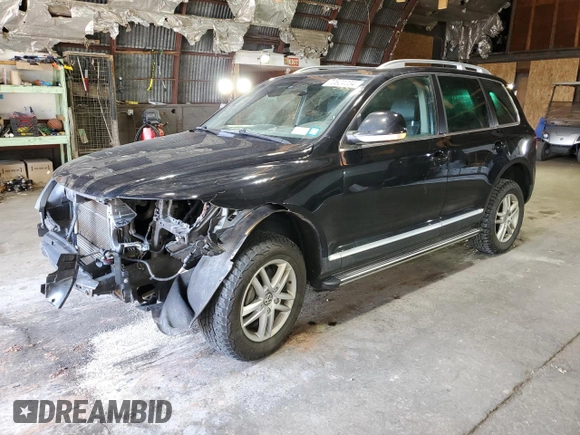 2010 Volkswagen Touareg VR6 with VIN WVGBF7A99AD002591, listed as a Copart auction lot 70624234 with 154,330 mi miles and Salvage Title. Bid and sale history available at DreamBid. Image 1.