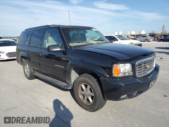2000 Cadillac Escalade z VIN 1GYEK13R0YR167895, wystawiony jako Copart lot #82586443 z przebiegiem 267 099 mil mil oraz Szkoda całkowita • Salvage title. Historia ofert i sprzedaży dostępna na DreamBid. Obrazek 4.