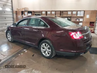 2011 Ford Taurus SEL z VIN 1FAHP2HW5BG141570, wystawiony jako IAAI lot #41867097 z przebiegiem 172 984 mil mil oraz . Historia ofert i sprzedaży dostępna na DreamBid. Obrazek 3.