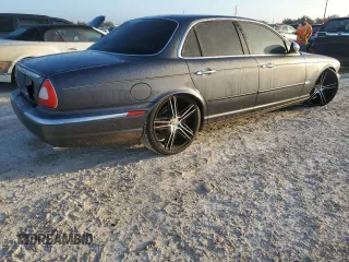 2004 Jaguar XJ with VIN SAJEA74C24SG09038, listed as a Copart auction lot 77015544 with Not Provided miles and Salvage Title. Bid and sale history available at DreamBid. Image 3.