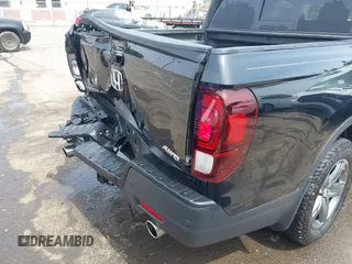 2023 Honda Ridgeline RTL-E with VIN 5FPYK3F76PB042100, listed as a IAAI auction lot 42274861 with 16,822 mi miles and . Bid and sale history available at DreamBid. Image 17.