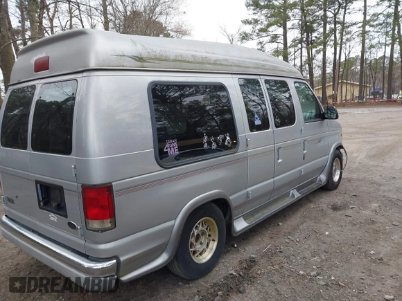 2002 Ford Econoline Cargo with VIN 1FDRE14W72HB82339, listed as a IAAI auction lot 41730429 with 214,165 mi miles and . Bid and sale history available at DreamBid. Image 4.