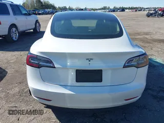 2020 Tesla Model 3 Standard Range Plus with VIN 5YJ3E1EA7LF797150, listed as a IAAI auction lot 41869088 with 75,708 mi miles and . Bid and sale history available at carsss.com. Image 16.