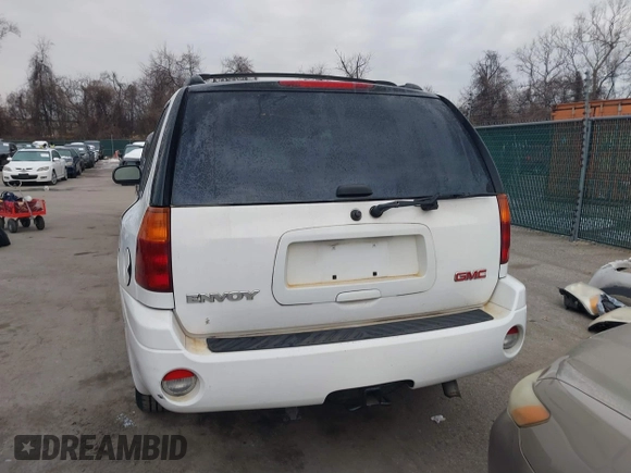 2005 GMC Envoy SLT with VIN 1GKDT13S952190876, listed as a IAAI auction lot 41308686 with 244,774 mi miles. Bid and sale history available at carsss.com. Image 17.