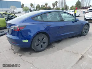 2021 Tesla Model 3 Long Range with VIN 5YJ3E1EB6MF878411, listed as a IAAI auction lot 41986947 with 71,978 mi miles. Bid and sale history available at carsss.com. Image 4.