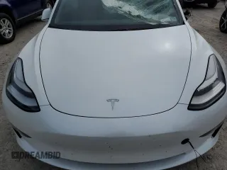 2020 Tesla Model 3 Long Range z VIN 5YJ3E1EB9LF801059, wystawiony jako Copart lot #58312495 z przebiegiem Nie podano mil oraz Szkoda całkowita • Salvage title. Historia ofert i sprzedaży dostępna na DreamBid. Obrazek 11.