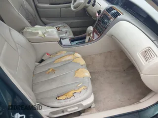 2000 Toyota Avalon XL z VIN 4T1BF28B6YU036865, wystawiony jako IAAI lot #42402305 z przebiegiem 202 265 mil mil oraz . Historia ofert i sprzedaży dostępna na DreamBid. Obrazek 5.