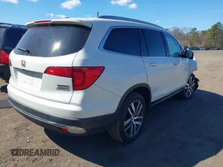 2017 Honda Pilot Touring z VIN 5FNYF6H99HB089121, wystawiony jako IAAI lot #41896878 z przebiegiem 145 330 mil mil oraz . Historia ofert i sprzedaży dostępna na DreamBid. Obrazek 4.
