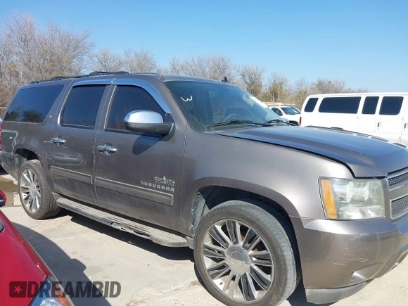2011 Chevrolet Suburban LT with VIN 1GNSCJE03BR381301, listed as a IAAI auction lot 41412636 with 243,601 mi miles. Bid and sale history available at carsss.com. Image 2.