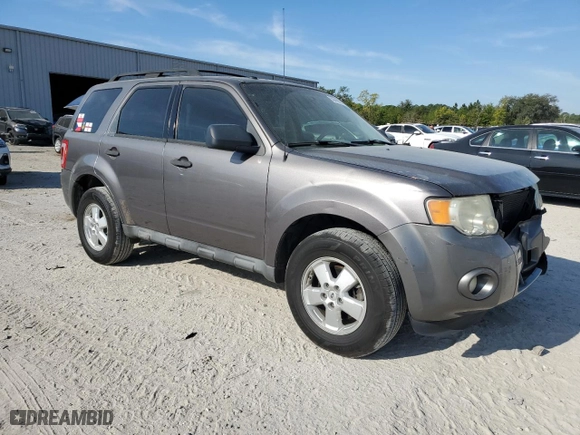 2010 Ford Escape XLT with VIN 1FMCU0DG6AKD05058, listed as a Copart auction lot 50449035 with 127,781 mi miles and Salvage Title. Bid and sale history available at carsss.com. Image 4.