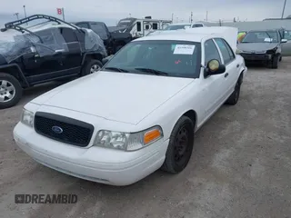 2006 Ford Police Interceptor z VIN 2FAFP71W96X150559, wystawiony jako IAAI lot #41590316 z przebiegiem 127 728 mil mil oraz . Historia ofert i sprzedaży dostępna na DreamBid. Obrazek 17.