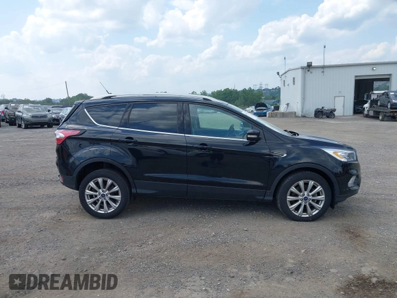 2018 Ford Escape Titanium z VIN 1FMCU9J9XJUB66275, wystawiony jako IAAI lot #42757952 z przebiegiem 97 629 mil mil oraz . Historia ofert i sprzedaży dostępna na DreamBid. Obrazek 13.