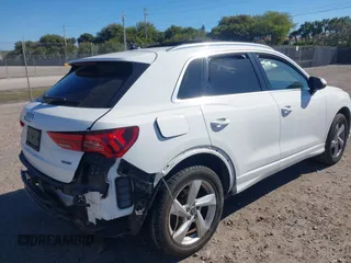 2021 Audi Q3 Premium with VIN WA1AUCF32M1097059, listed as a IAAI auction lot 41825132 with 66,144 mi miles and . Bid and sale history available at DreamBid. Image 4.