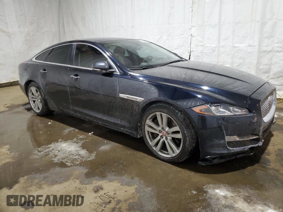 2016 Jaguar XJ with VIN SAJXJ1GD2G8V98776, listed as a Copart auction lot 41959995 with 77,391 mi miles and Salvage title. Bid and sale history available at DreamBid. Image 4.