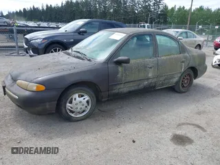 1995 Ford Contour z VIN 3FALP6633SM116313, wystawiony jako IAAI lot #42058920 z przebiegiem 192 905 mil mil oraz . Historia ofert i sprzedaży dostępna na DreamBid. Obrazek 2.