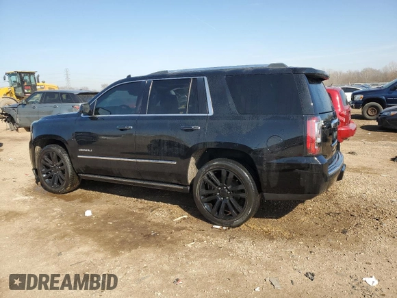 2016 GMC Yukon Denali with VIN 1GKS2CKJ9GR301628, listed as a Copart auction lot 48937035 with 121,863 mi miles and Salvage Title. Bid and sale history available at carsss.com. Image 2.