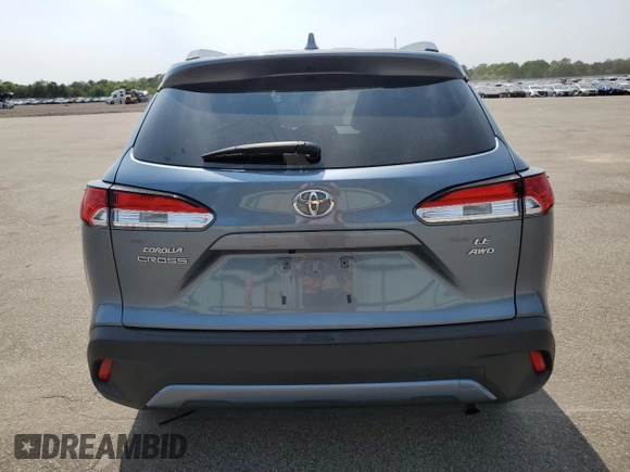 2023 Toyota Corolla Cross LE with VIN 7MUCAABG4PV054828, listed as a Copart auction lot 59466855 with 23,884 mi miles and Salvage title. Bid and sale history available at DreamBid. Image 6.