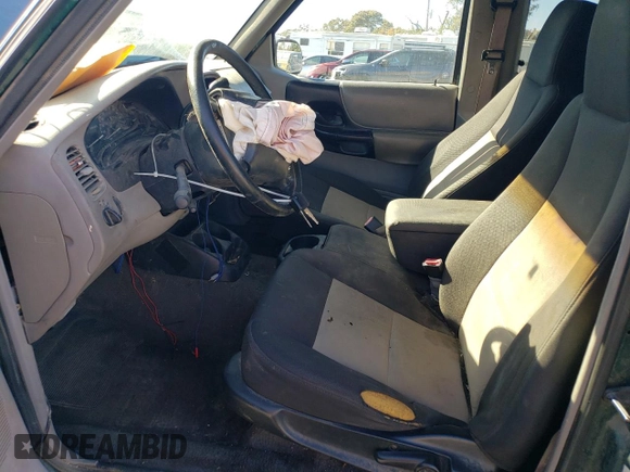 1999 Ford Ranger XLT with VIN 1FTYR14X1XPA61459, listed as a Copart auction lot 76380064 with 292,940 mi miles and Salvage Title. Bid and sale history available at DreamBid. Image 7.