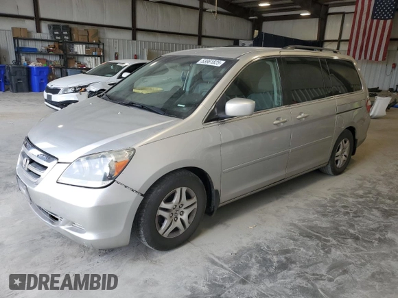 2007 Honda Odyssey EX with VIN 5FNRL38477B429624, listed as a Copart auction lot 53961825 with 144,957 mi miles and Salvage Title. Bid and sale history available at DreamBid. Image 1.