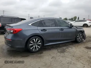 2023 Honda Civic EX z VIN 2HGFE1F72PH312995, wystawiony jako Copart lot #57284305 z przebiegiem 7 921 mil mil oraz Szkoda całkowita • Salvage title. Historia ofert i sprzedaży dostępna na DreamBid. Obrazek 3.