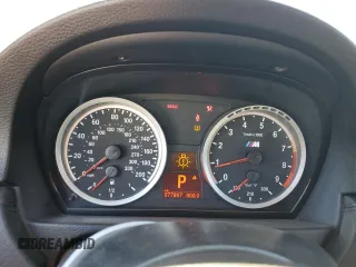 2011 BMW M3 with VIN WBSKG9C50BE369021, listed as a Copart auction lot 77999704 with 77,897 mi miles and Salvage Title. Bid and sale history available at carsss.com. Image 9.