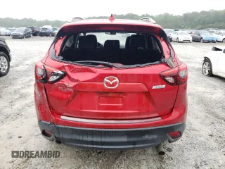 2016 Mazda CX-5 Grand Touring z VIN JM3KE2DY8G0623423, wystawiony jako Copart lot #58599545 z przebiegiem 131 932 mil mil oraz Szkoda całkowita • Salvage title. Historia ofert i sprzedaży dostępna na DreamBid. Obrazek 6.
