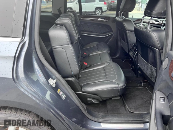 2013 Mercedes-Benz GL 450 z VIN 4JGDF7CE1DA247796, wystawiony jako Copart lot #59948105 z przebiegiem 133 542 mil mil oraz Czysty tytuł • Clean title. Historia ofert i sprzedaży dostępna na DreamBid. Obrazek 6.