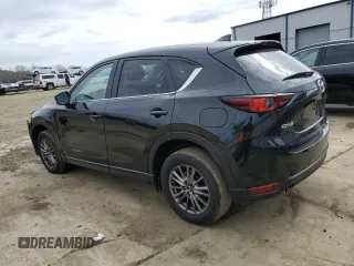 2017 Mazda CX-5 Touring with VIN JM3KFACLXH0195725, listed as a Copart auction lot 47464365 with 65,457 mi miles and Salvage Title. Bid and sale history available at carsss.com. Image 2.