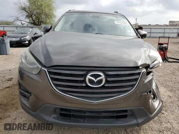 2016 Mazda CX-5 Grand Touring z VIN JM3KE2DY7G0735355, wystawiony jako Copart lot #49438285 z przebiegiem 132 731 mil mil oraz Szkoda całkowita • Salvage title. Historia ofert i sprzedaży dostępna na DreamBid. Obrazek 5.