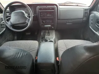1999 Jeep Cherokee Sport with VIN 1J4FF68S4XL580048, listed as a Copart auction lot 62546365 with 154,059 mi miles and Clean title. Bid and sale history available at DreamBid. Image 8.