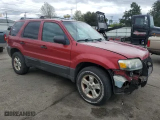 2005 Ford Escape XLT with VIN 1FMYU93105KD73059, listed as a Copart auction lot 53149615 with 143,739 mi miles and Salvage Title. Bid and sale history available at carsss.com. Image 4.
