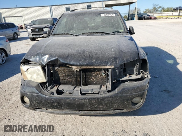 2002 GMC Envoy SLE with VIN 1GKDS13S022512481, listed as a Copart auction lot 74701454 with 0 mi miles and Salvage Title. Bid and sale history available at carsss.com. Image 5.