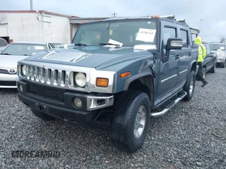 2005 Hummer H2 SUT with VIN 5GRGN22U15H114401, listed as a IAAI auction lot 41268764 with 166,651 mi miles. Bid and sale history available at carsss.com. Image 2.