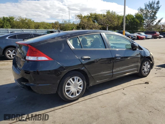 2010 Honda Insight LX with VIN JHMZE2H50AS009869, listed as a Copart auction lot 53031515 with 194,860 mi miles and Salvage Title. Bid and sale history available at DreamBid. Image 3.