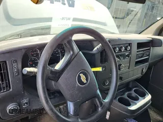 2014 Chevrolet Express Cargo Van with VIN 1GCWGFBA2E1171252, listed as a IAAI auction lot 42207161 with 200,713 mi miles. Bid and sale history available at carsss.com. Image 1.