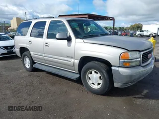 2004 GMC Yukon SLT with VIN 1GKEC13V74J311617, listed as a IAAI auction lot 41785561 with 225,245 mi miles. Bid and sale history available at carsss.com. Image 1.
