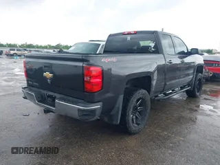 2016 Chevrolet Silverado 1500 LT with VIN 1GCVKREH3GZ233606, listed as a IAAI auction lot 42111728 with 90,449 mi miles and . Bid and sale history available at DreamBid. Image 4.