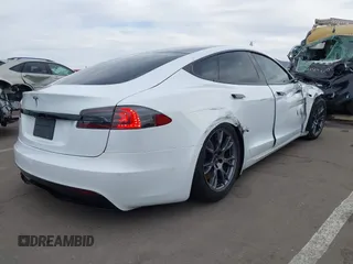 2021 Tesla Model S Long Range with VIN 5YJSA1E57MF453815, listed as a IAAI auction lot 41818700 with 51,176 mi miles and . Bid and sale history available at DreamBid. Image 4.