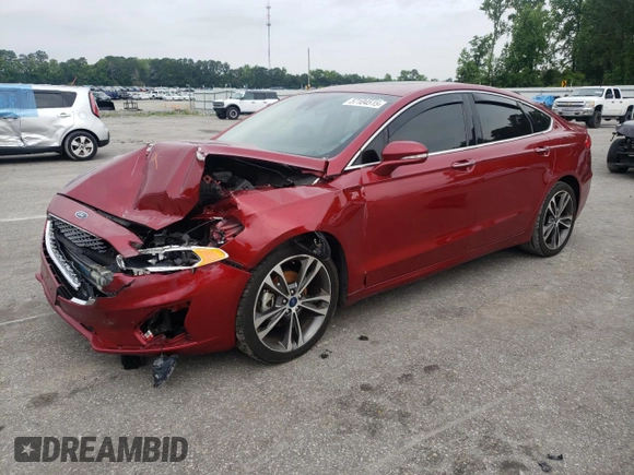 2019 Ford Fusion Titanium z VIN 3FA6P0D99KR221328, wystawiony jako Copart lot #57104515 z przebiegiem 138 427 mil mil oraz Szkoda całkowita • Salvage title. Historia ofert i sprzedaży dostępna na DreamBid. Obrazek 1.