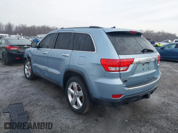 2013 Jeep Grand Cherokee Overland with VIN 1C4RJFCT2DC572978, listed as a IAAI auction lot 41468915 with 223,528 mi miles. Bid and sale history available at carsss.com. Image 3.