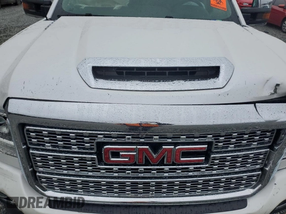 2019 GMC Sierra 2500HD Denali z VIN 1GT12SEY8KF150379, wystawiony jako Copart lot #80525704 z przebiegiem Nie podano mil oraz Szkoda całkowita • Salvage title. Historia ofert i sprzedaży dostępna na DreamBid. Obrazek 12.