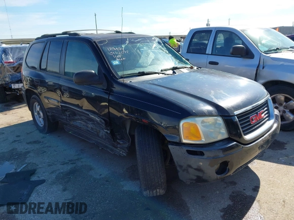 2003 GMC Envoy SLE with VIN 1GKDS13S732134354, listed as a IAAI auction lot 41305506 with 221,733 mi miles. Bid and sale history available at carsss.com. Image 1.