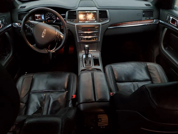 2015 Lincoln MKS with VIN 1LNHL9DK7FG606935, listed as a Copart auction lot 81991384 with 82,097 mi miles and Salvage Title. Bid and sale history available at carsss.com. Image 8.