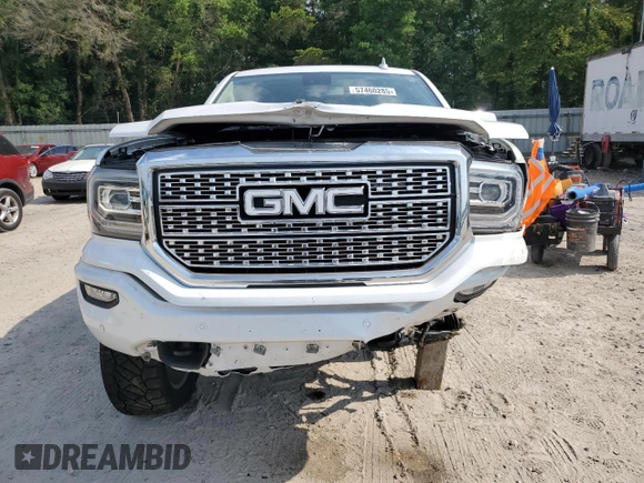 2017 GMC Sierra 1500 Denali z VIN 3GTU2PEJ2HG433669, wystawiony jako Copart lot #57460285 z przebiegiem 131 113 mil mil oraz Szkoda całkowita • Salvage title. Historia ofert i sprzedaży dostępna na DreamBid. Obrazek 5.