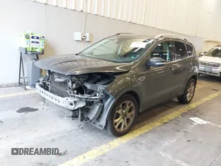 2016 Ford Escape Titanium with VIN 1FMCU9J92GUB63525, listed as a IAAI auction lot 41469824 with 156,773 mi miles. Bid and sale history available at carsss.com. Image 2.
