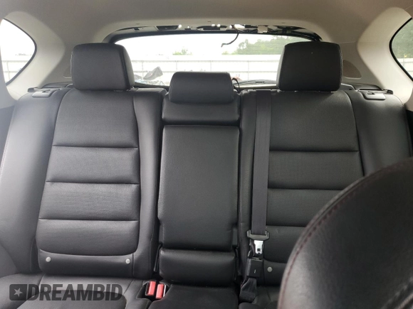 2016 Mazda CX-5 Grand Touring z VIN JM3KE2DY5G0676290, wystawiony jako Copart lot #54155325 z przebiegiem 124 743 mil mil oraz Szkoda całkowita • Salvage title. Historia ofert i sprzedaży dostępna na DreamBid. Obrazek 10.